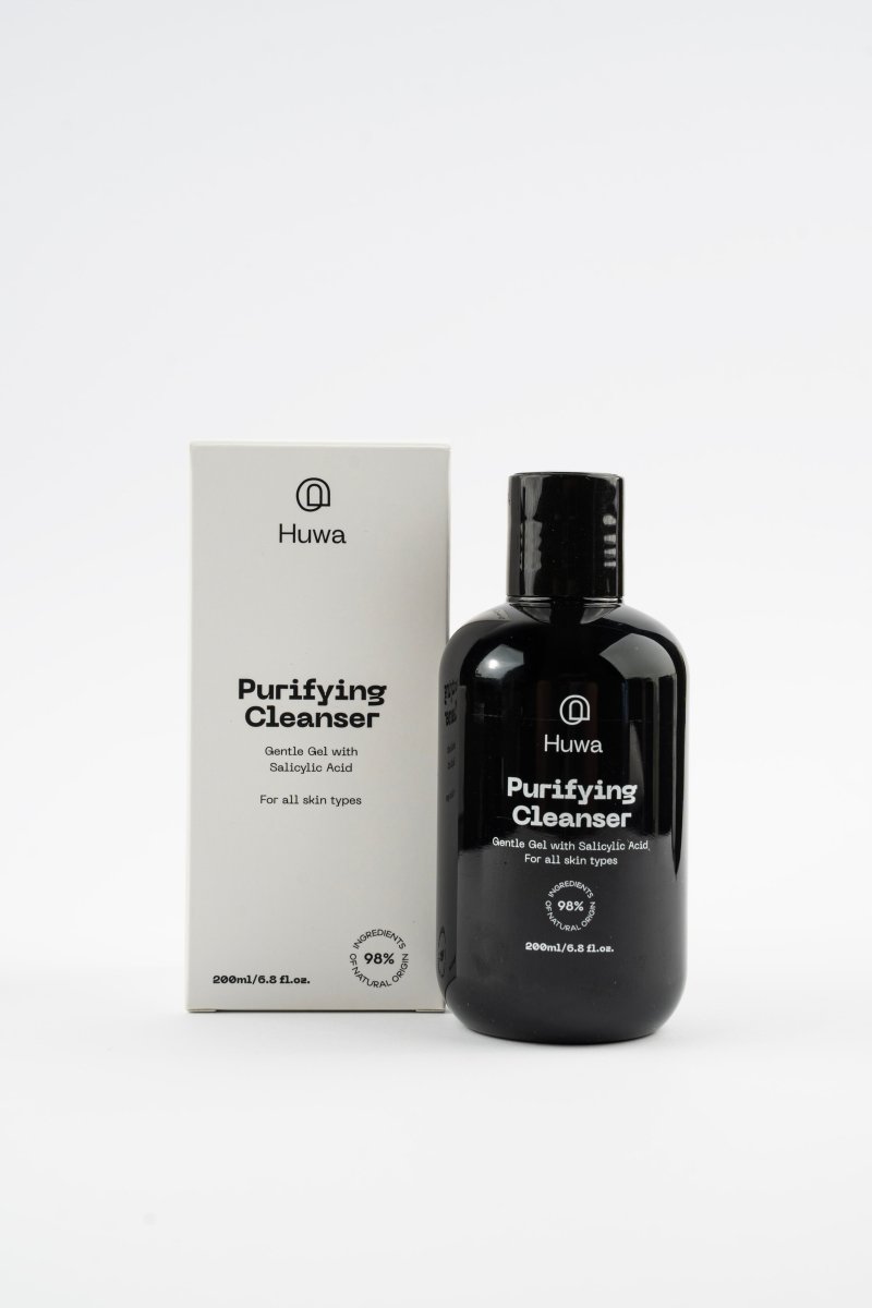 Box and bottle huwa skincare purifying cleanser with salicylic acid front view on a white background and with natural origins ingredients percentage
