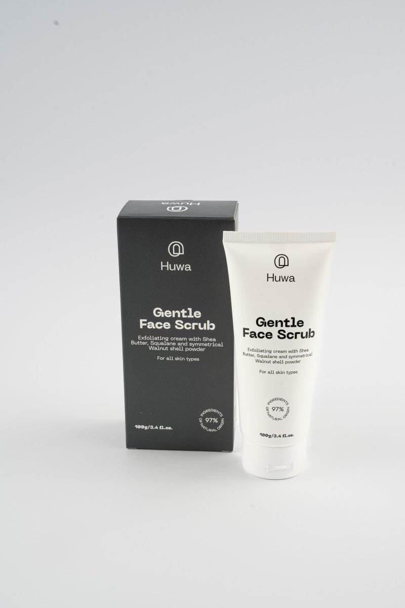 Huwa Skincare Gentle Face Scrub with shea butter and squalene and packaging including a cool gray color box and white tube on a white background front view
