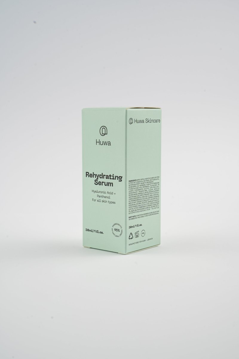Huva Skincare Rehydrating Serum box on a white background with logo side view with list of ingredients and percentage of ingredients from natural origins