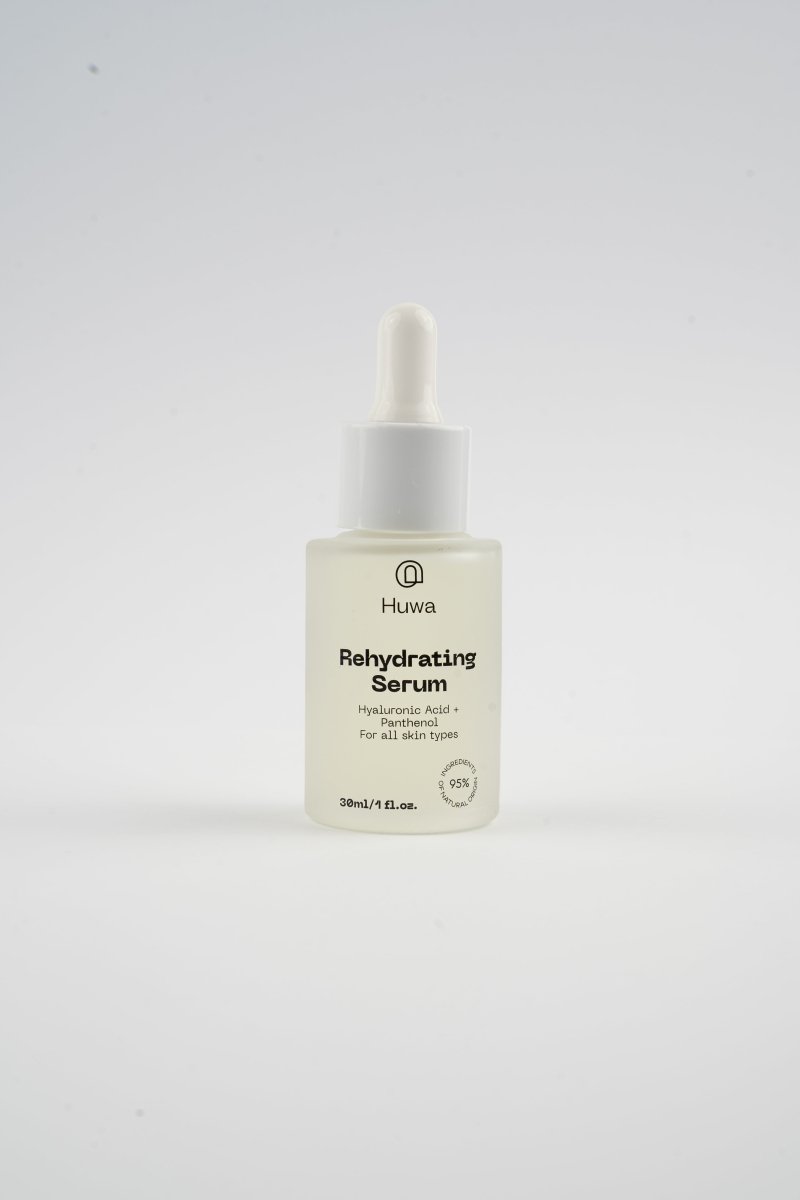 Huwa Skincare rehydrating serum bottle which is frosted glass with white dropper on a white background