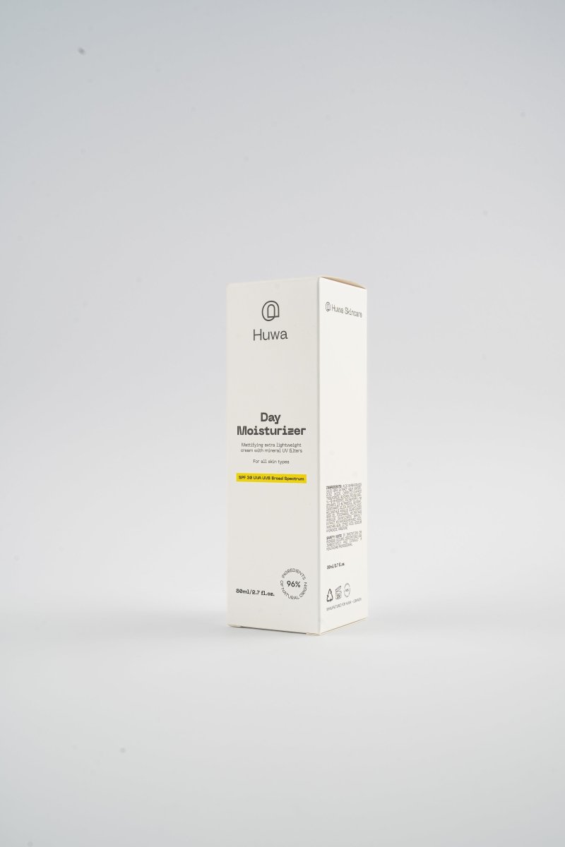 Huwa Skincare Day Moisturizer packaging on a white background with yellow highlight for SPF protection against UVA and UVB