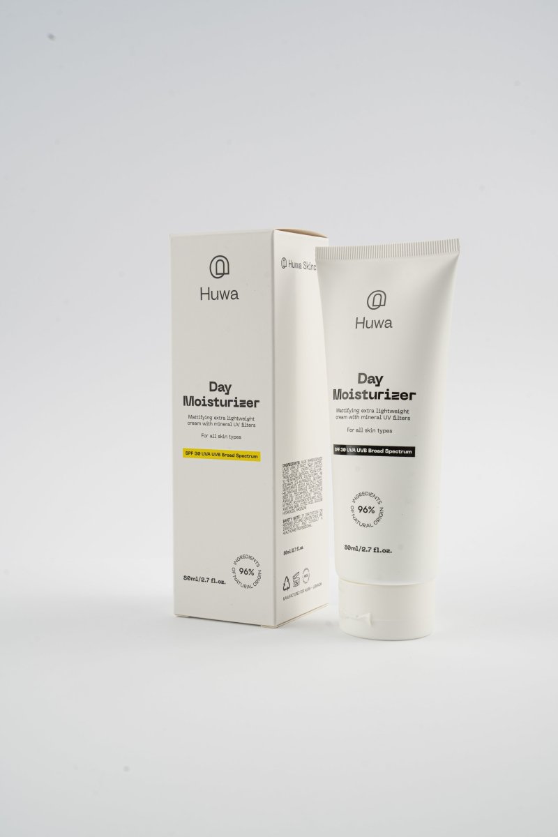 Huwa Day Moisturizer packaging on a white background tube and box showing that it is 96 percent of ingredients from natural origins