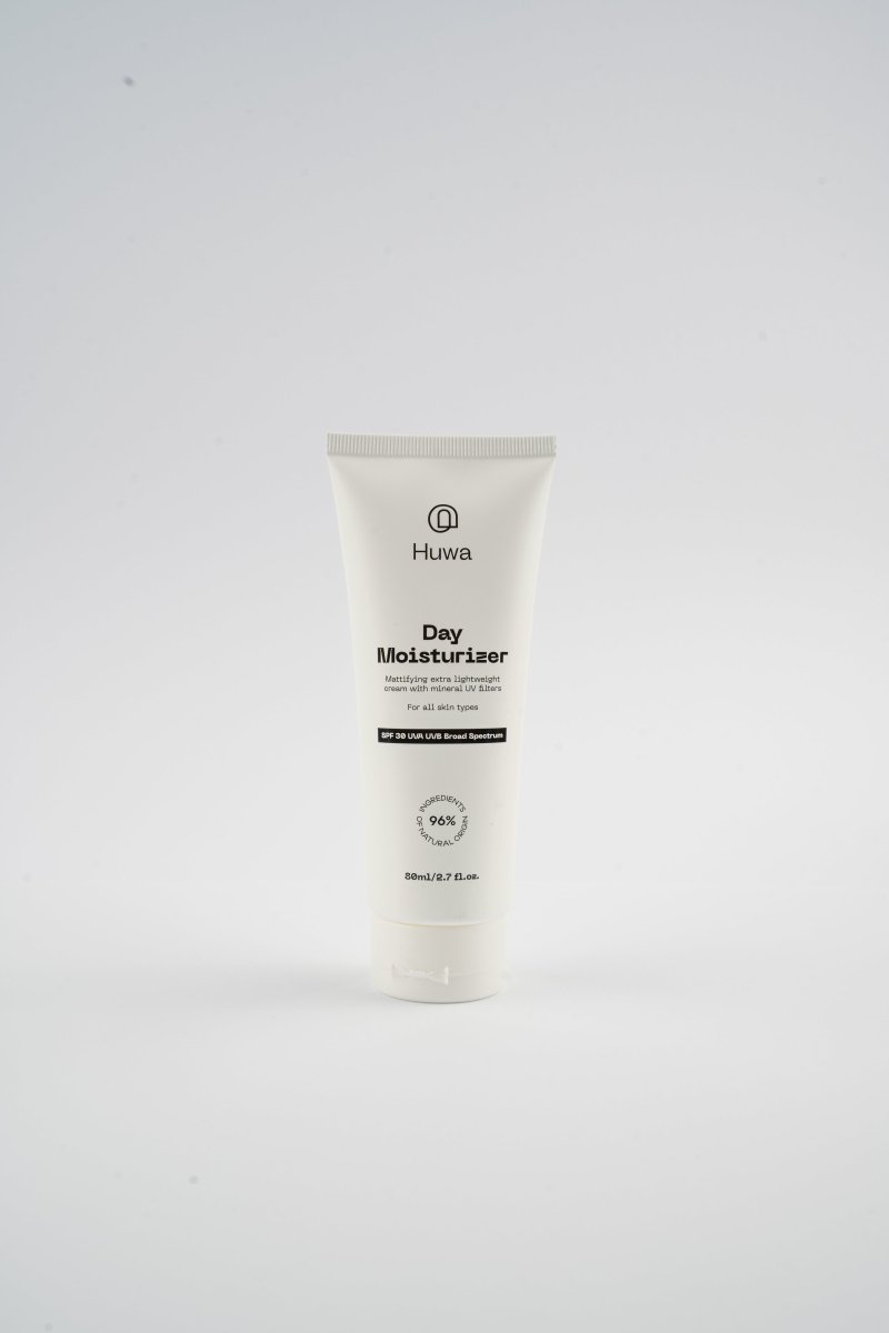Huwa Day Moisturizer tube with SPF and mattiying cream tube on a white background front view and natural origins